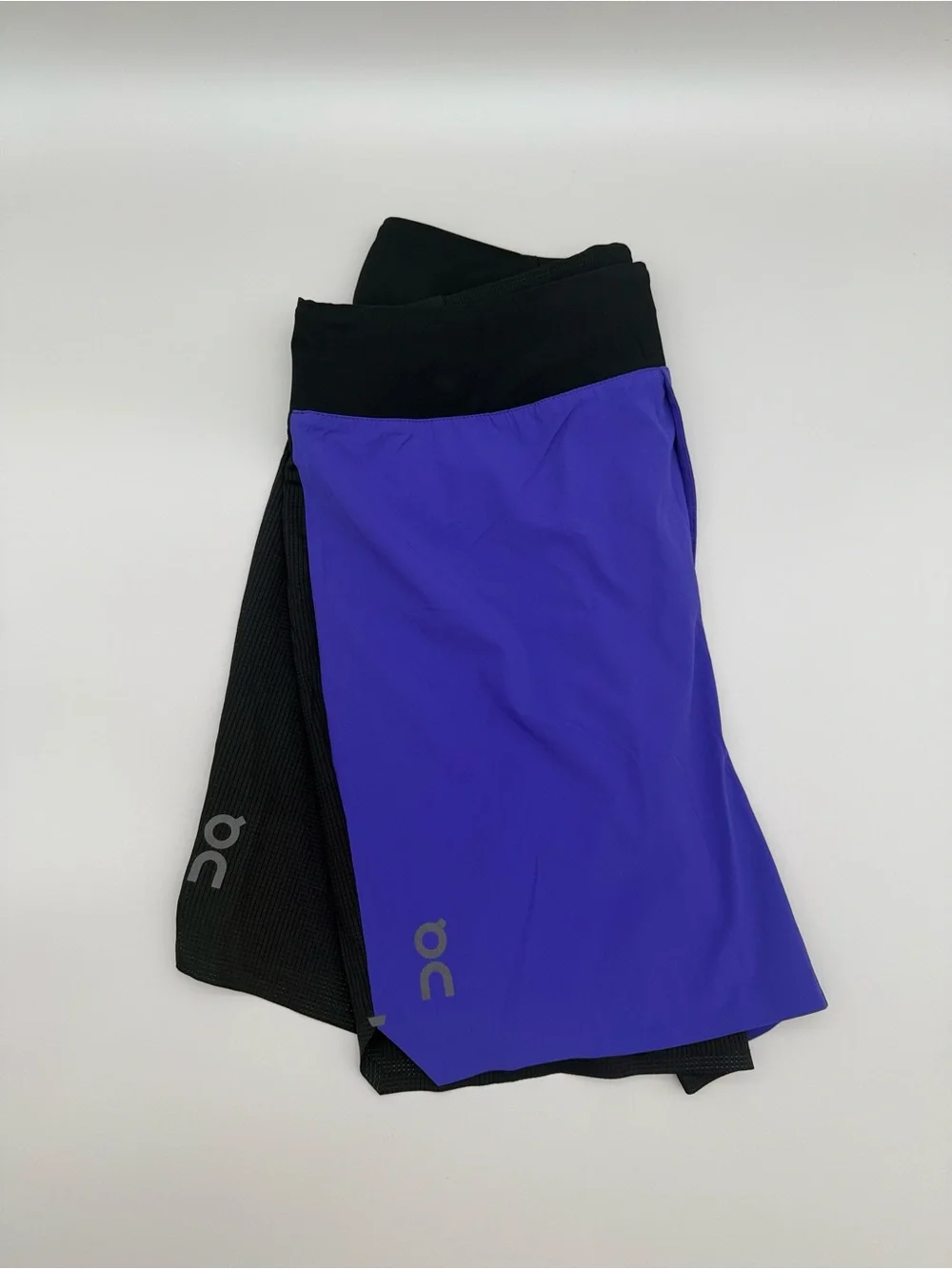 On Running Black Waistband blue and black Men Running Shorts size men’s Medium.